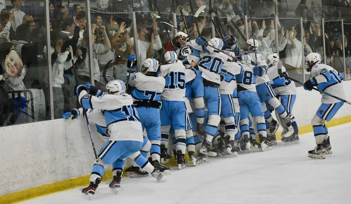 Livonia Stevenson hockey rushes the ice and jumps into the glass celebrating in front of the student section.