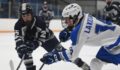 Nathan Dell looks to make a play with the puck on his stick for Lakeland Hockey in a Lakes Valley Conference (LVC) game against South Lyon Unified.