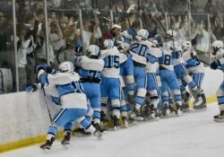 Livonia Stevenson hockey rushes the ice and jumps into the glass celebrating in front of the student section.
